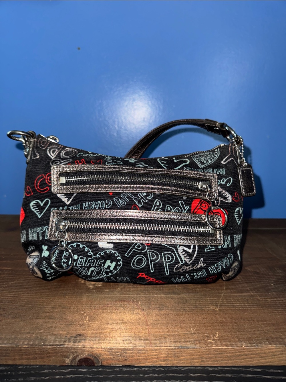 Coach Black Poppy Graphic Mini Wristlet with Red & Light Blue Accents - Picture 1 of 10